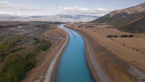 drone view over man-made hydro canals used for hydroelectricity