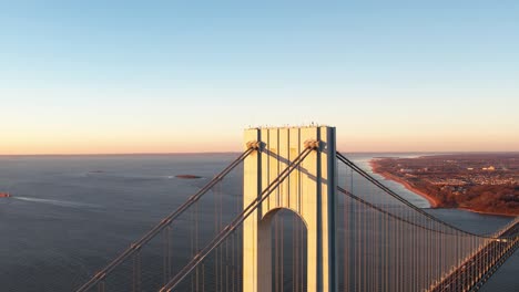 Verrazzano-Narrows-bridge-and-the-sea,-golden-hour-in-New-York,-USA---aerial-view