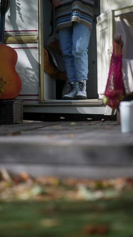 woman stepping out of camper van