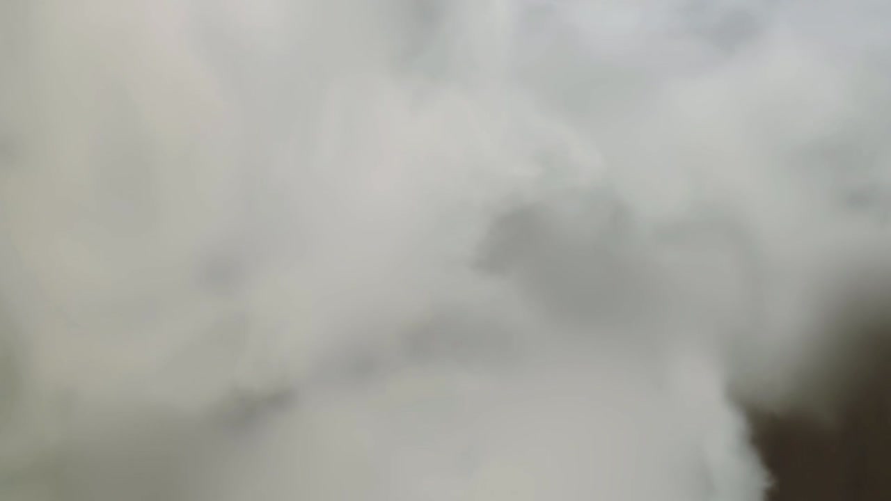 Smoke fumes against dark background