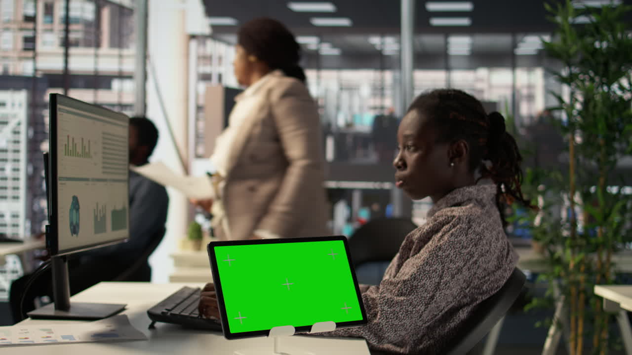 Woman Working on Tablet in Office