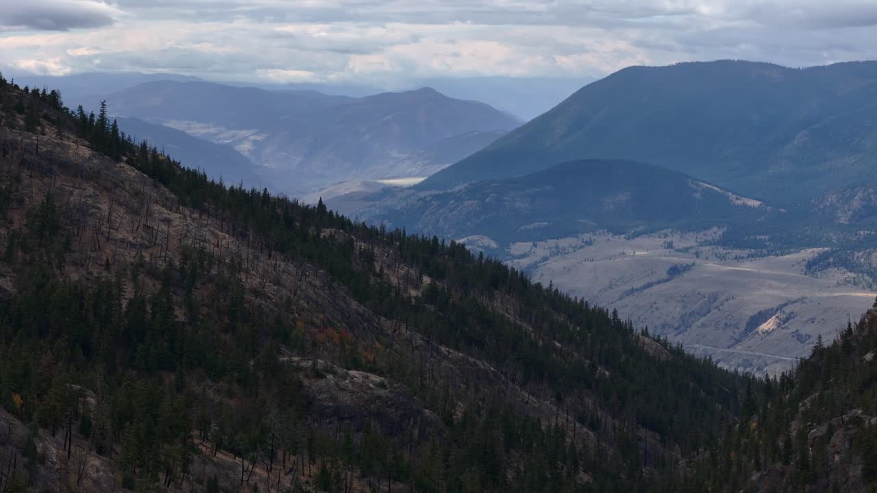 Bird's-Eye View of the Ashcroft, BC Vicinity: Untouched Woodlands and Semi-Arid Desert Landscape on a Cloudy Day
