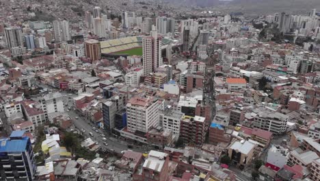 aerial from crowded hillside toward la paz olympic stadium, bolivia