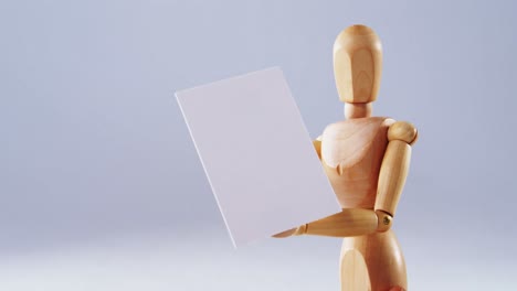 Figurine-holding-blank-placard