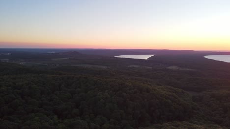 aerial view of sleeping bear dunes, and good harbor at sunset with a beautiful gradient of color in the sky