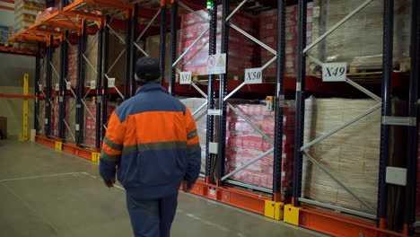 warehouse worker operating automated storage system