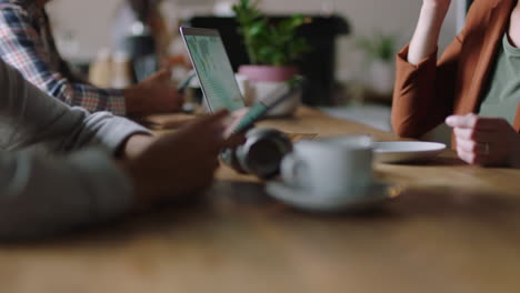 close-up-business-people-hands-using-laptop-computer-browsing-smartphone-social-media-working-sharing-creative-ideas-online-internet-connection-in-busy-cafe