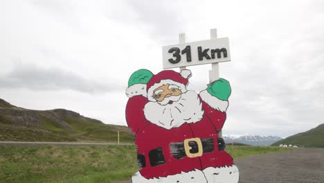 santa claus cutout in the mountains of iceland with gimbal video walking forward