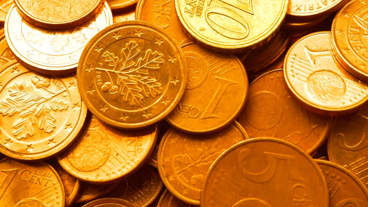 The video of the money cent euro coin. The background is a video footage.