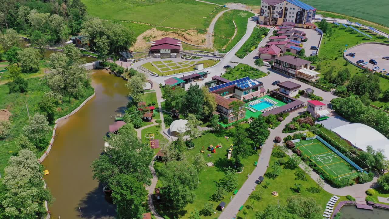 Resting area in nature. Recreation complex with various attractions for healthy lifestyle. Relax center among nature landscape. Aerial view.