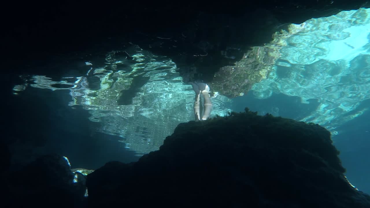 Underwater cave with reflection of the surface
