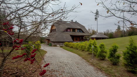 panning time lapse of a cobblestone walkway leading to a countryside chalet