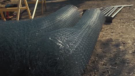 wire fencing rolled up on construction site