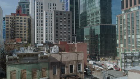 establishing tilt-up shot of the spiral 66 hudson boulevard skyscraper in new york city - midtown manhattan - day