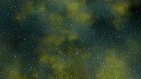 universe with flying dust and yellow clouds