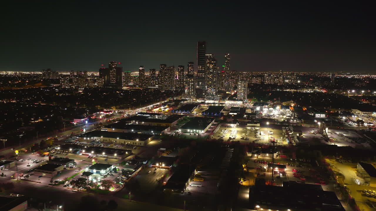 Night view of downtown Mississauga condos with city lights glowing