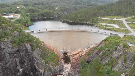 concrete wall of sarvsfossen dam in bykle, norway