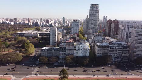 aerial cinematic view of avenida libertador avenue and car traffic in buenos aires city, argentina