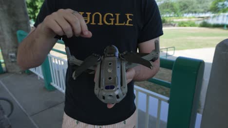 man explaining the various parts of a drone before flight