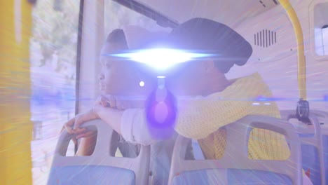 animation of light beam and lens flare over two african american woman on bus looking out of window