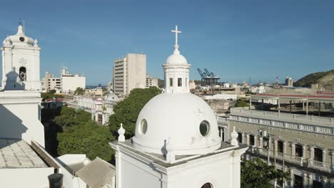 drone zooms out from the cross of christ to reveal the cathedral of santa marta