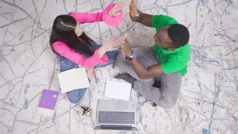 interracial couple and preparing household budget in living room.