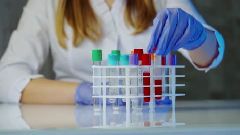 scientist holding test tube. technician of health with blood tubes in the clinical lab for analytical