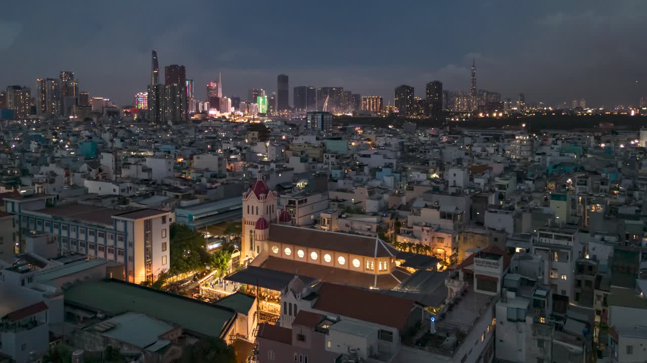 Evening to night hyperlapse over high density urban area with city skyline in background