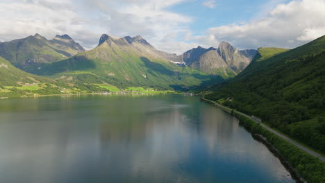 innfjorden fjord, coastal village with mountain ridge in romsdalen, norway