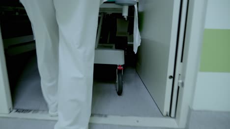 nurse moving a hospital bed