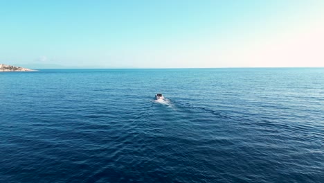 motorboat in the sea riding towards open waters