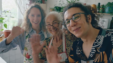 happy family waving together at camera in home kitchen