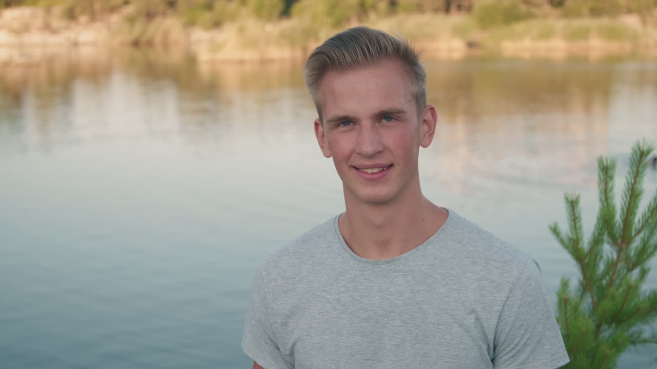 Young Man Posing at Lake