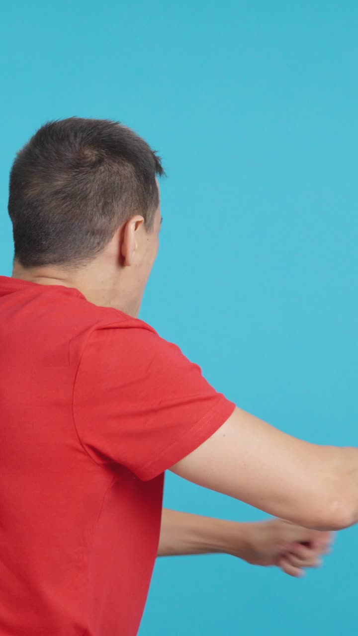Rear view of a man waving a danish pennant