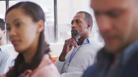 Business-people-attending-to-a-meeting-in-conference-room