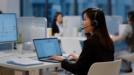 Woman working in a busy call center
