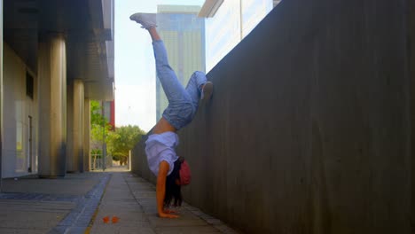 young female dancer performing dance under bridge 4k