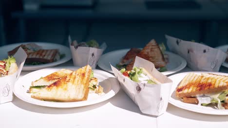 Fresh-sandwiches-on-the-table-on-the-beach-in-summer