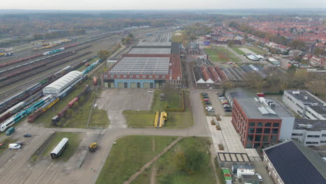 high jib up of train yard with old workshops