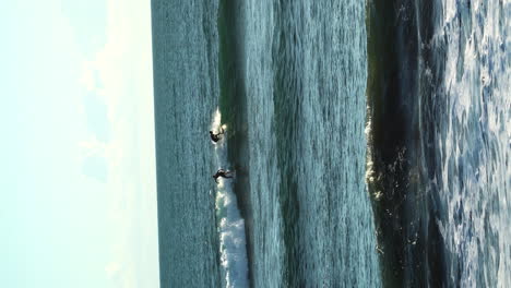 Vertical-shot-of-sunny-day-at-Bali-beach