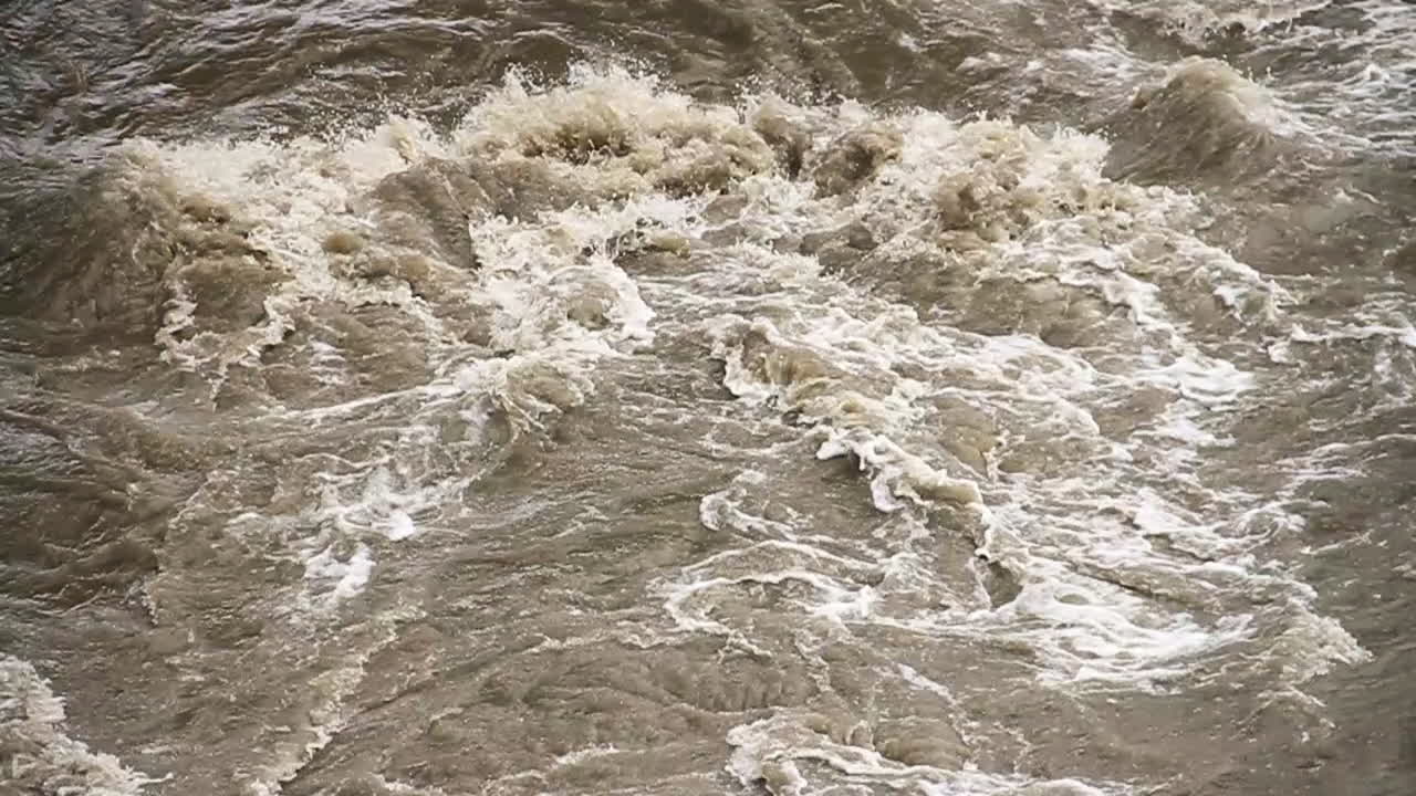 Brown Water River Rapids Rush down Stream