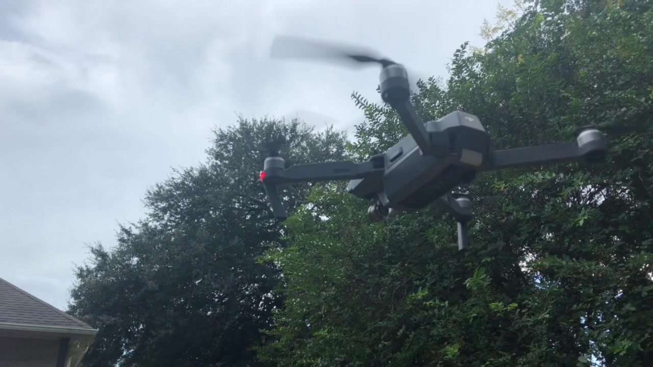 dji mavic pro hover above yard.
