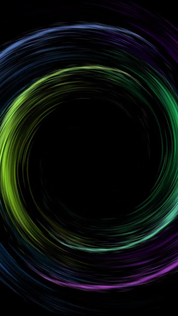 Animation of colourful light trails forming circles on black background