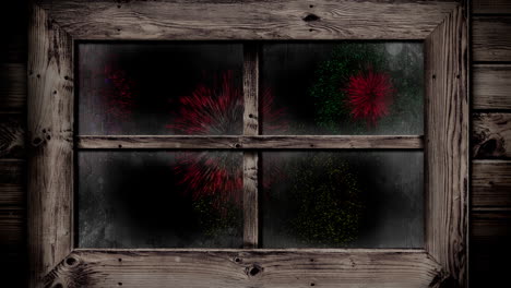 animation of window with colourful christmas and new year fireworks exploding in night sky