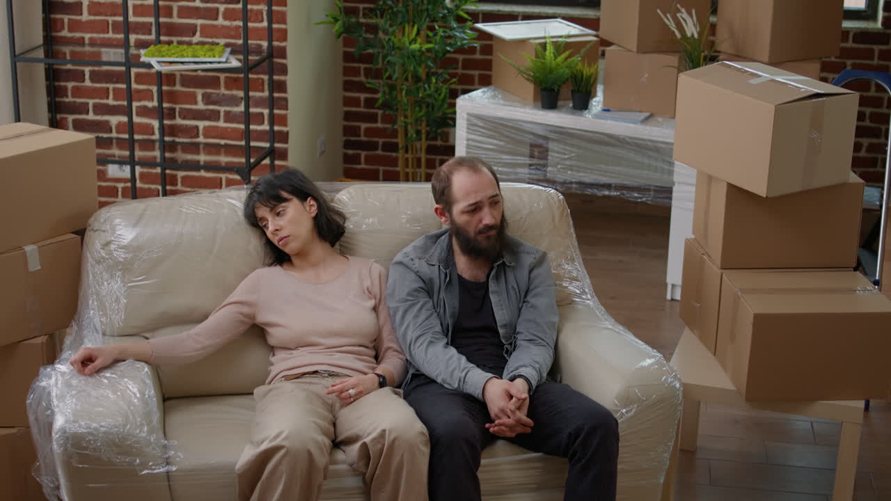 Life partners feeling exhausted about moving in and decorating