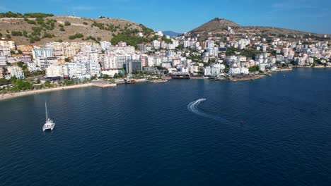 summer bliss: embracing the azure beauty of saranda's coastal city, a prime tourist destination with a deep blue sea backdrop