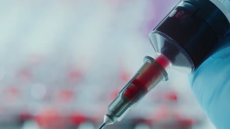 performing venipuncture with syringe for blood testing in laboratory