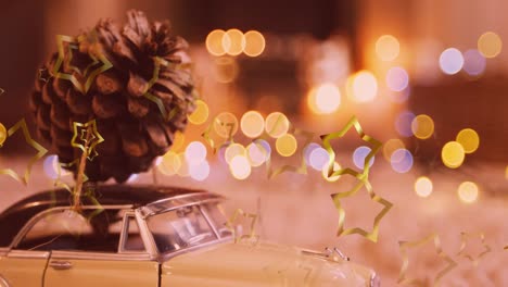 animation of glowing stars falling over christmas decorations with pine cone on model car