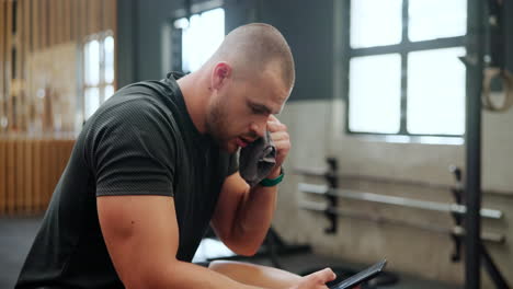 man resting after workout in the gym