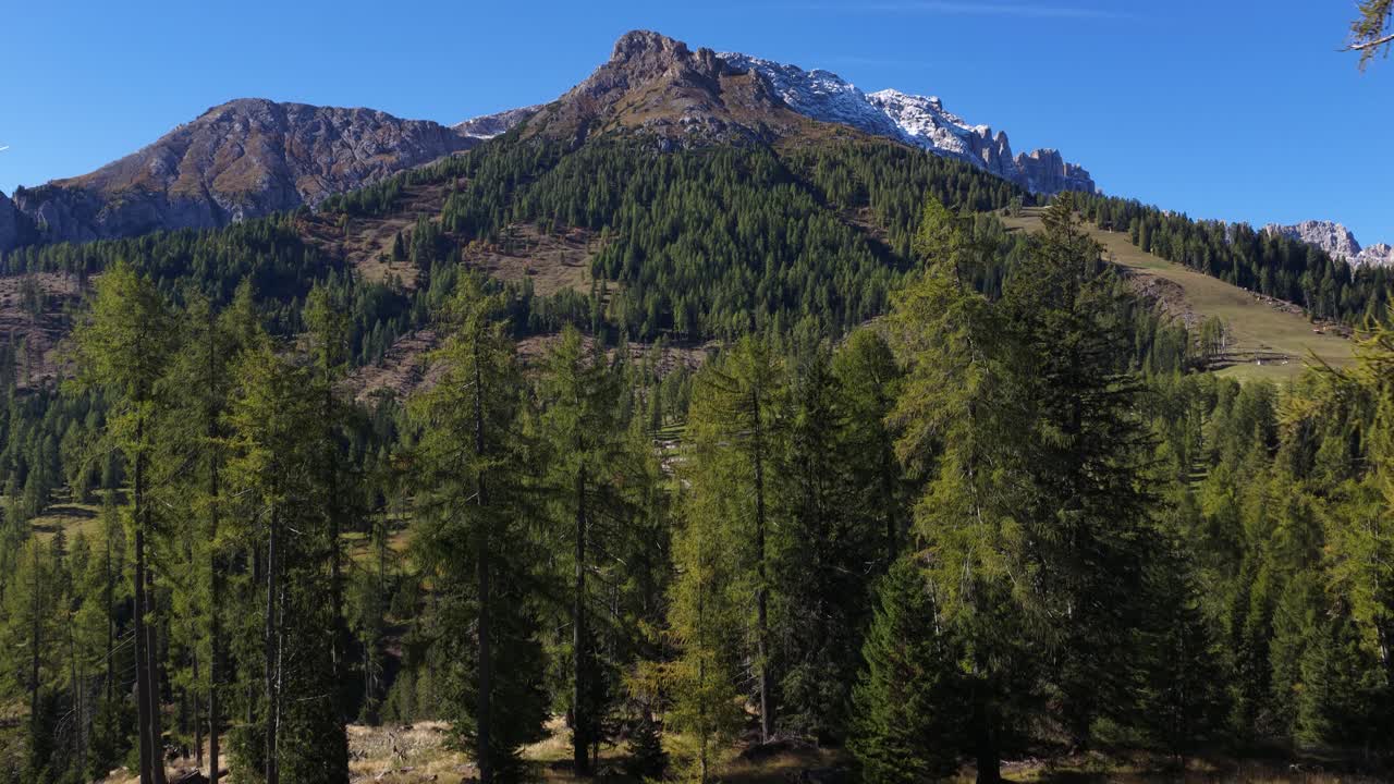 The Italian dolomites, revealing aerial on mountain ridge. Summer time. Drone video